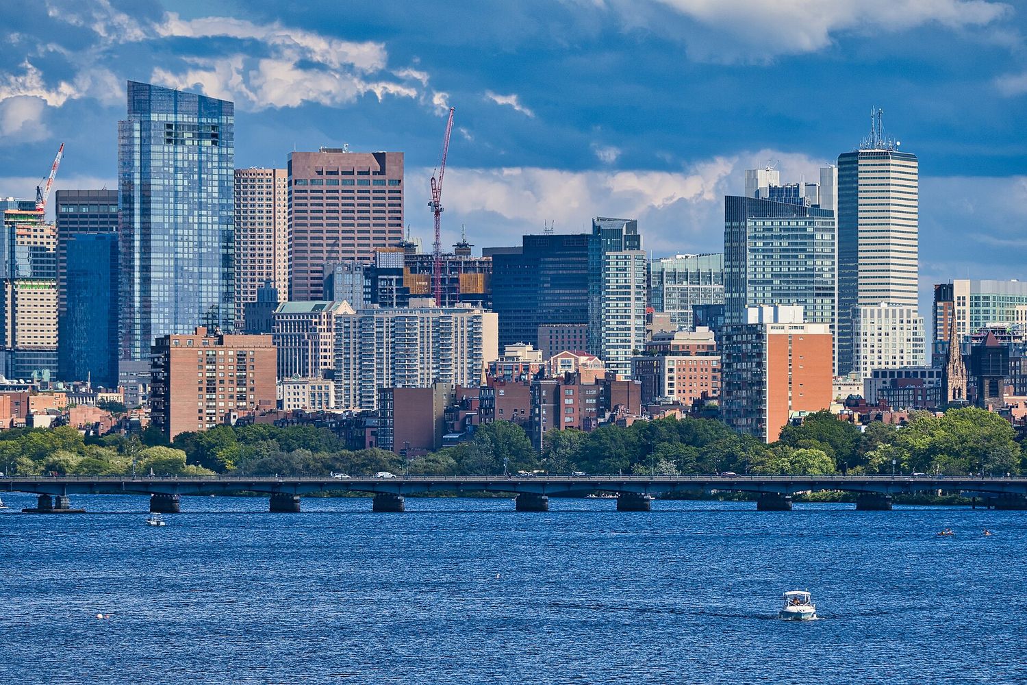 Back Bay's towers, including the Prudential Tower, rising above the Charles River in Boston.